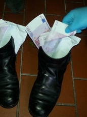 €50,000 was found in each shoe.