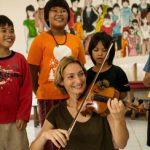 Italian violinist strikes a chord with street kids