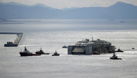 Costa Concordia reaches final dock in Genoa