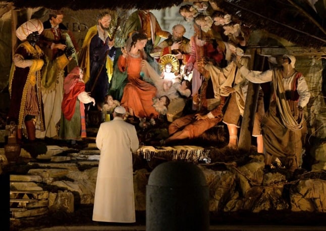 Pope Francis in front of a classic nativity scene in St Peter’s Square at the Vatican in 2013.