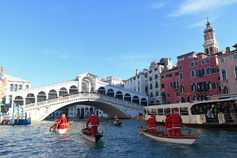 Dozens of boating Santas race in Venice's Grand Canal