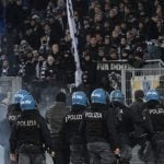 Italian police arrest rowdy German football fans after clashes in Rome