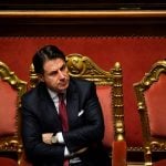 Why is Italian PM Conte being accused of a conflict of interest?