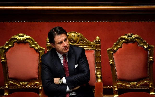 Why is Italian PM Conte being accused of a conflict of interest?