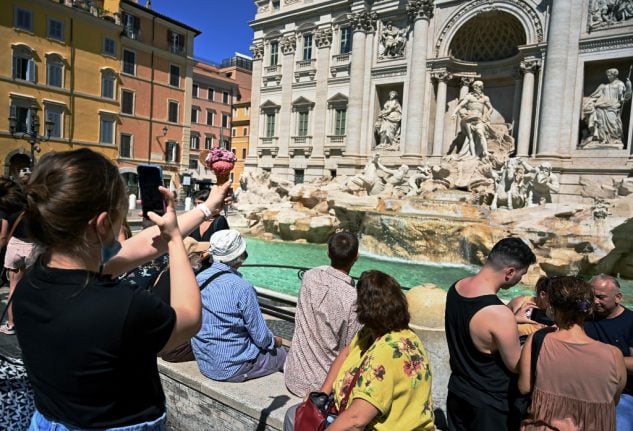 Italian police fine tourists €450 for carving names into Trevi Fountain