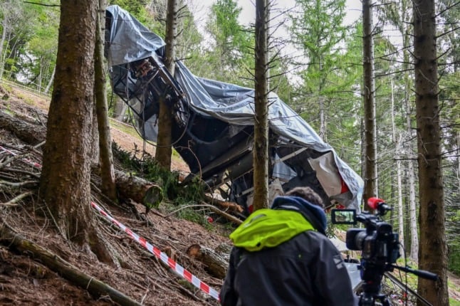 The wreckage of a cable car that crashed on the slopes of the Mottarone peak above Stresa, Piedmont on May 23, 2021, killing 14. 