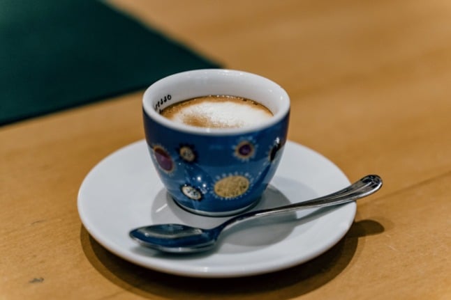 An Italian caffe macchiato with a spoonful of sugar on top.