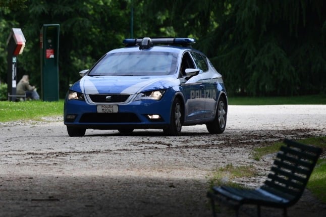 An Italian police car pictured in a park.