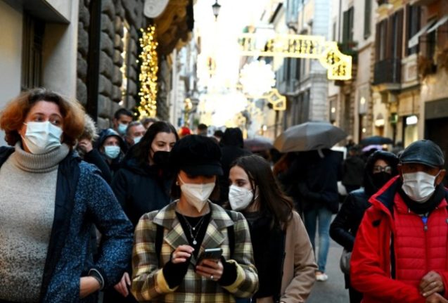 People wearing face masks outside in Rome, Italy.