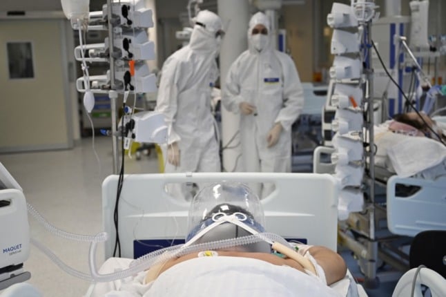 Medical staff stand near a patient in the Covid-19 intensive care unit at Rome's Institute of Clinical Cardiology.