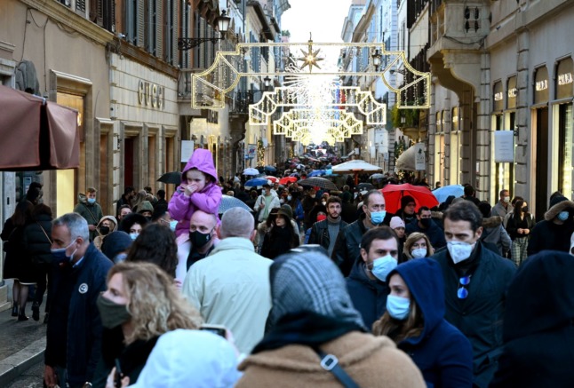 Face masks are required in all public spaces, including outdoors, in Italy’s yellow zones. 