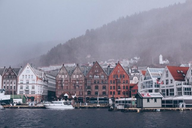 How many people move to Norway for work, and where do they come from?